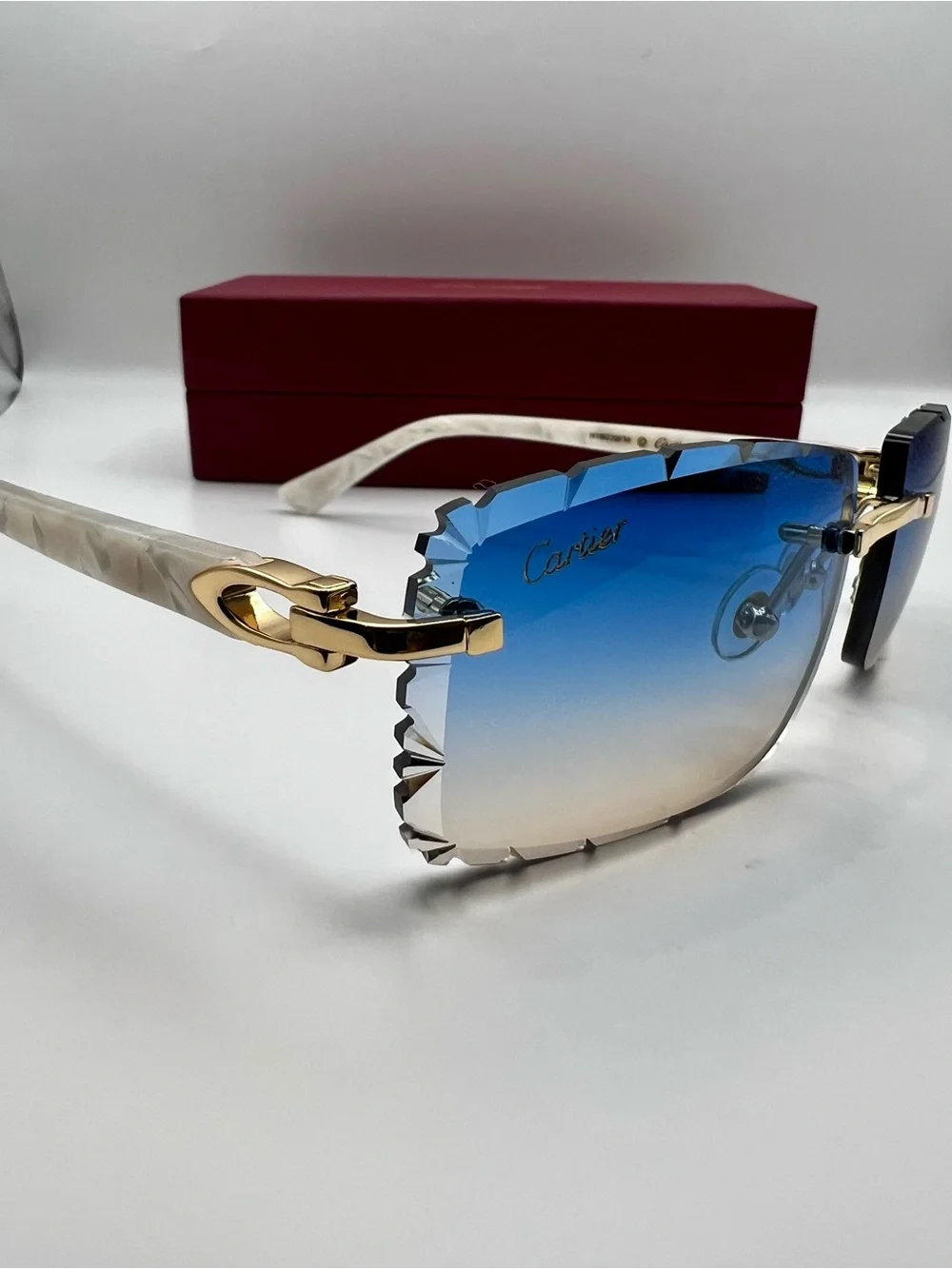 Cartier Blue Gradient Rimless Sunglasses with Gold and White Accents